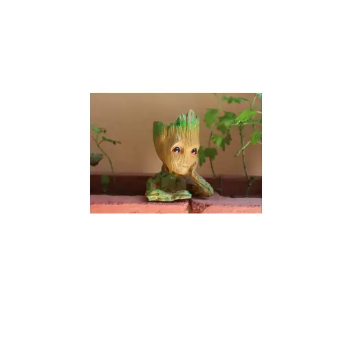 Resin Brown And Green Groot Thinking Plastic Showpiece, For Decoration, Packaging Type: Box